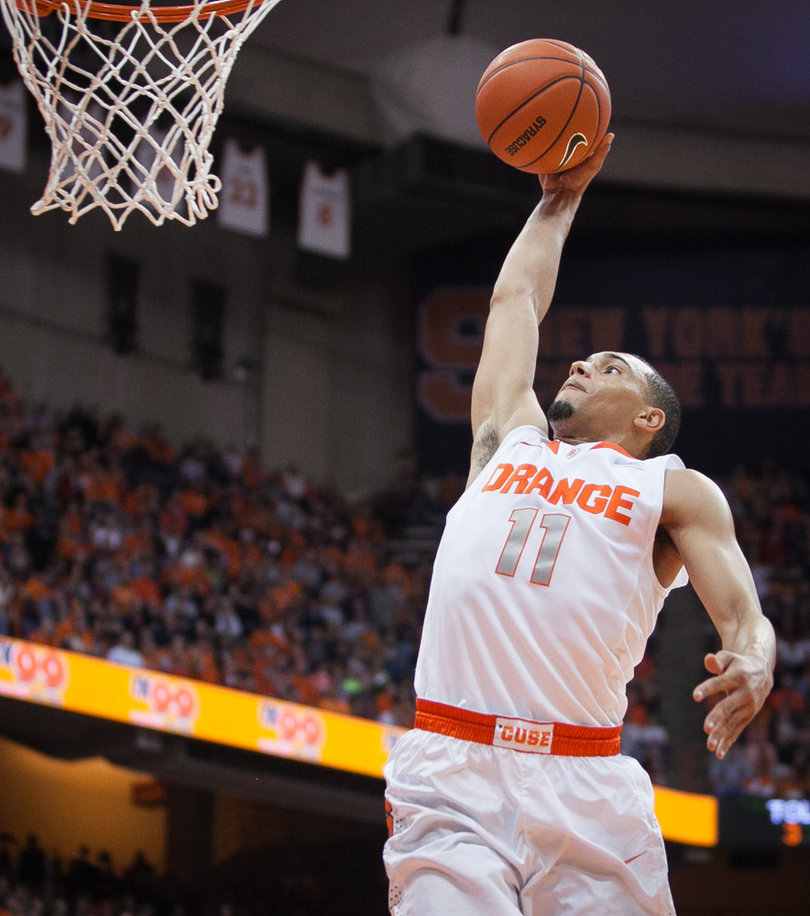 Ennis dunks the ball late in the second half. 