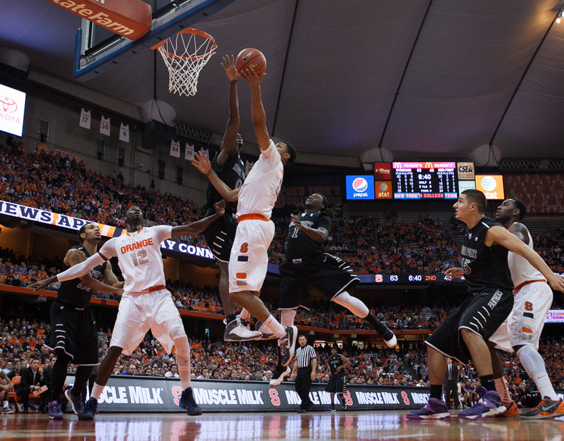 Michael Gbinije attempts to shoot the ball in the paint, but is rejected. 
