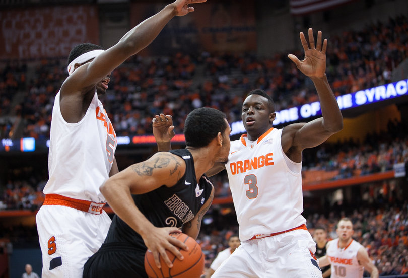 C.J. Fair (left) and Jerami Grant (right) defend against High Point's Adam Weary. 