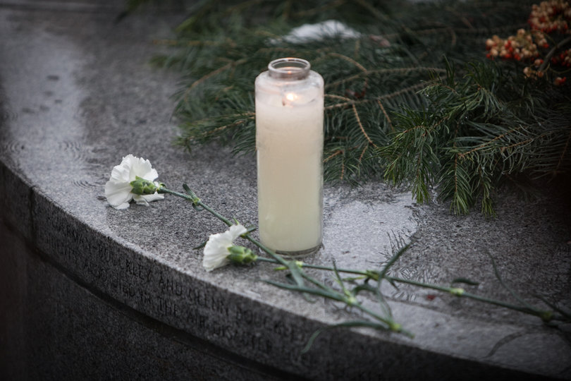 After the memorial service in Hendricks Chapel on Saturday, attendees proceeded to the Wall of Remembrance, where they laid white roses in the center of the memorial to pay tribute to the 35 SU students who lost their lives in Pan Am Flight 103. 