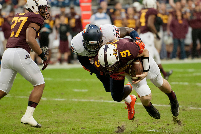 Dyshawn Davis flattens quarterback Philip Nelson.