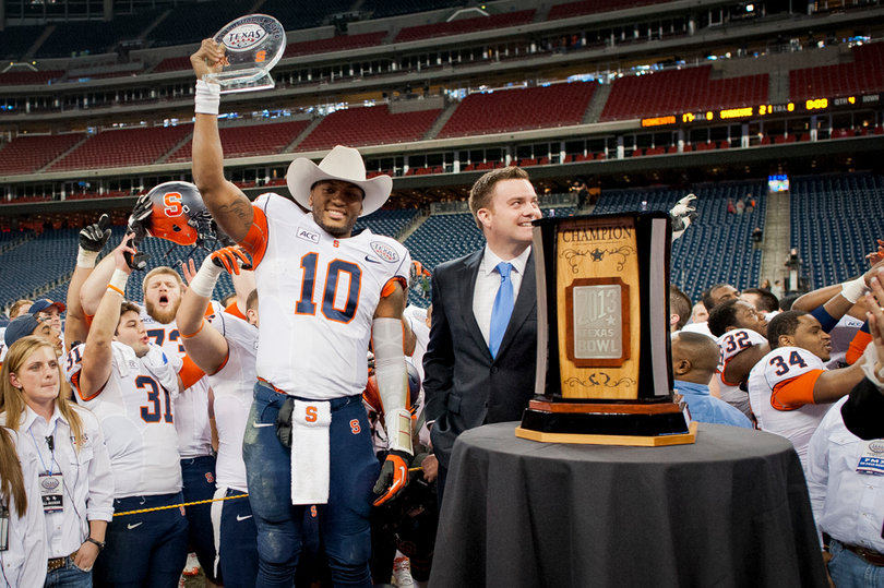 Hunt is given the Texas Bowl MVP trophy after leading the Orange past Minnesota in Reliant Stadium. 