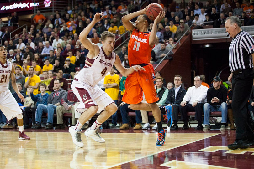 Ennis toes the baseline and looks for an open teammate while falling out of bounds. 