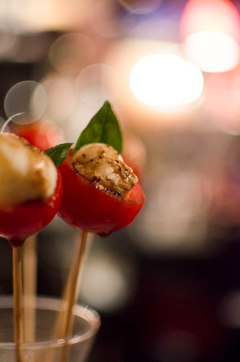 The chicken & prosciutto bites include sliced apple, and caramelized onions and topped with a cranberry gastrique sauce.