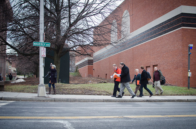 Syverud, Kevin Quinn, and others walk from Schine to Slutzker Center for International Students.