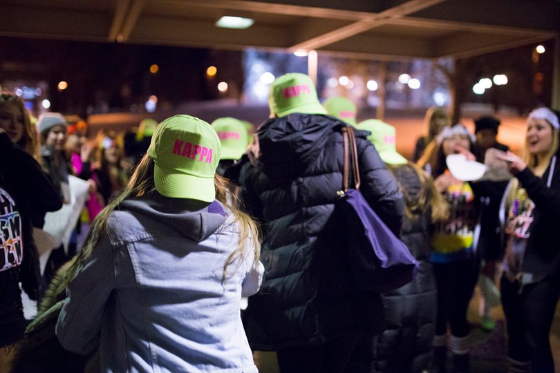 Kappa Kappa Gamma members race out of Schine to their house on Comstock Avenue. The house is one of 12 sororities on Syracuse University's campus. Delta Phi Epsilon was added to the council this year and began recruiting in October. 