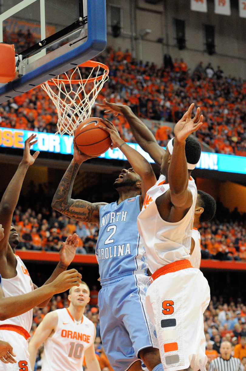 UNC's Leslie McDonald goes up for a shot but is contested by a trio of Syracuse defenders.