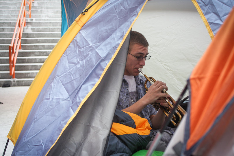 Jan. 31: Kevin Del Fuoco, a freshman music performance major, plays trumpet inside his tent next to Gate D of the Carrier Dome.