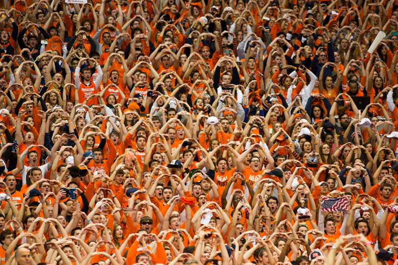 Fans form their hands into 'O's during the singing of the national anthem.