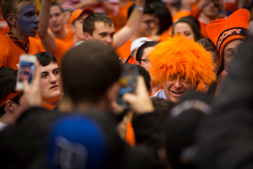 ESPN's Dick Vitale introduces himself to members of Otto's Army and dons a fan's Orange wig.  