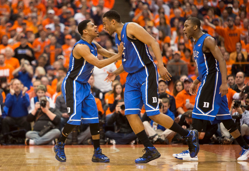 Cook and Parker celebrate after Parker completed a basket and drew a foul.