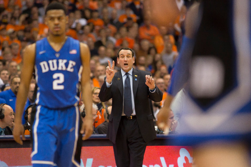 Krzyzewski directs his team during free throws. 