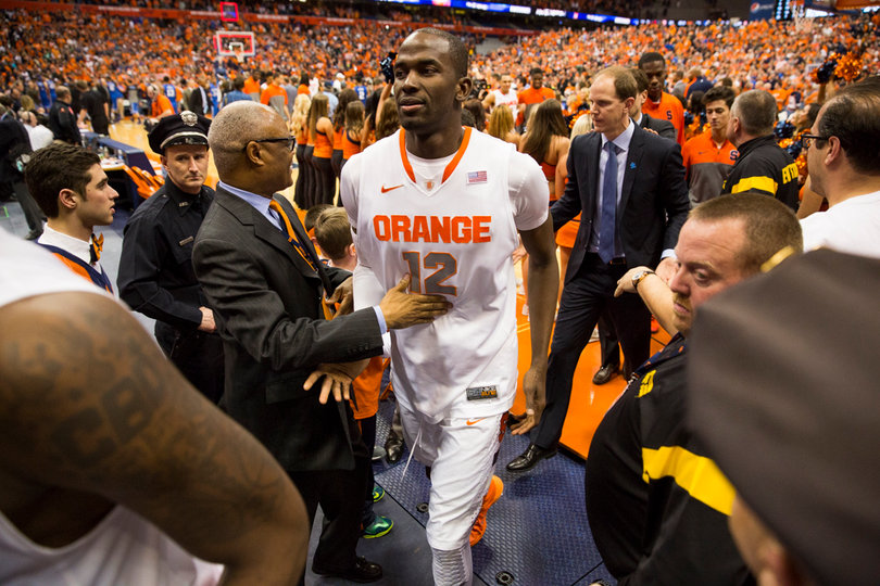Baye Moussa Keita leaves the floor following Syracuse's 91-89 overtime victory over Duke.