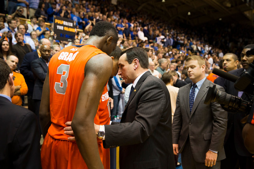 Mike Krzyzewski embraces Jerami Grant and Tyler Ennis following Duke's 66-60 victory over Syracuse 