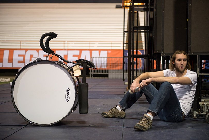 Mike "Sunshine" Barta, a senior communications and rhetorical studies major, takes a break during practice at the Carrier Dome on Wednesday. The Marching Band was forced to practice around the Mens Basketball court.