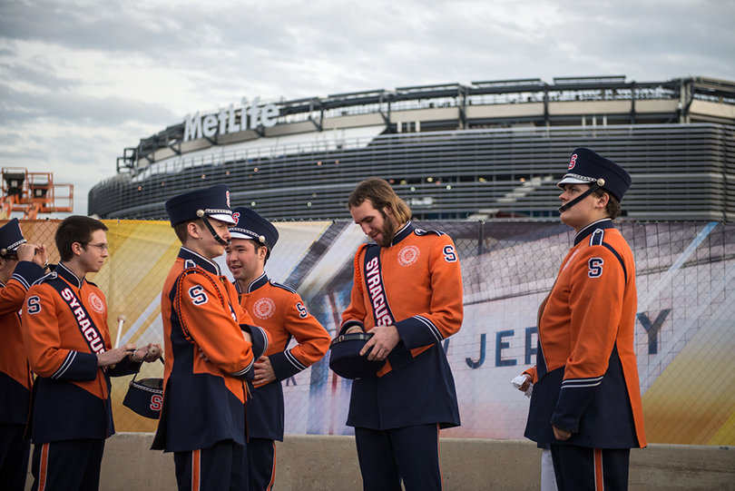 Members of the drumline assemble outside of MetLife Stadium before the Super Bowl on Sunday evening.