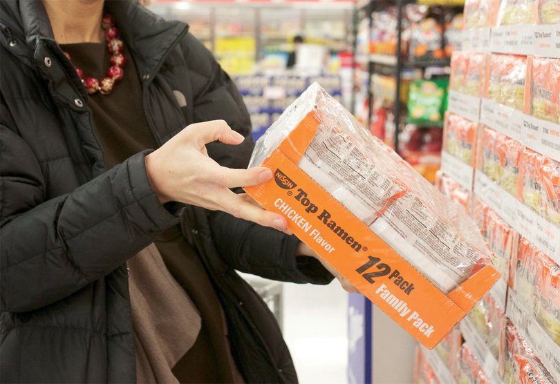 Tiffany Steinwert  looks through the food at PriceRite grocery store Monday. It was one of the stores where Steinwert shopped during the SNAP Challenge last week.