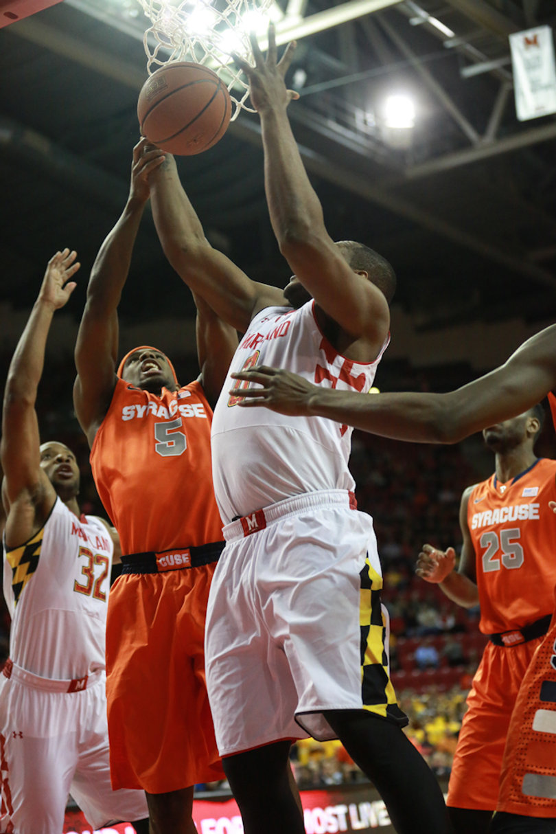 Fair and Mitchell meet in the paint while fighting for a loose ball. 