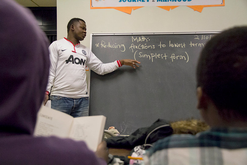 Osman Ramadhani instructs refugee students. Ramadhani came to Syracuse from Somalia in 2004. 