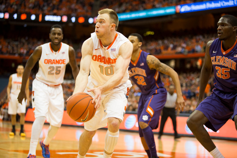 Trevor Cooney attacks the basket as Rakeem Christmas looks on. 