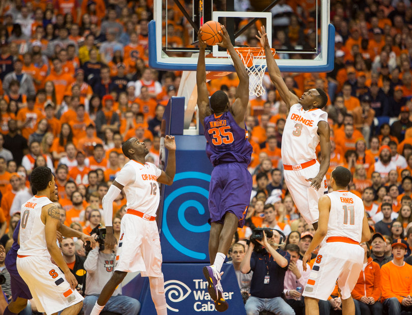 Grant attempts to block Nnoko's shot in the first half. 