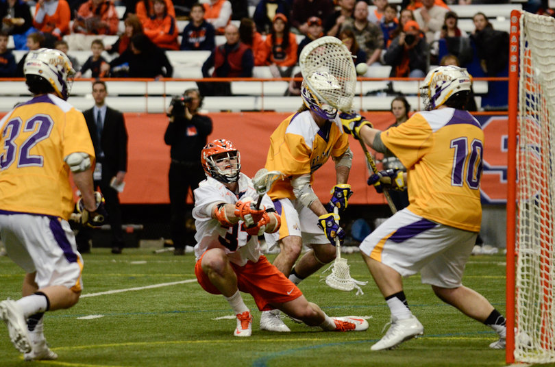 Riodan saves a shot as Jon Newhouse looks on. 