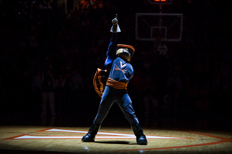 The Virginia mascot invigorates the sold-out crowd in a spotlight prior to the game. 