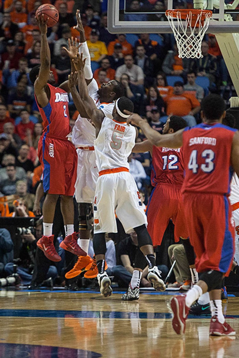 Baye Moussa Keita and Fair contest a shot in the paint. 