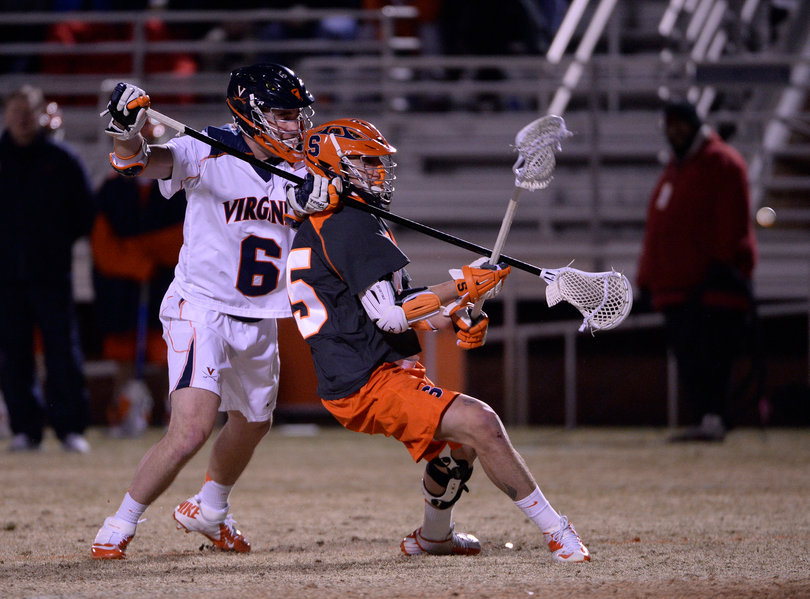 Syracuse attack Randy Staats works against Virginia defender Tanner Scales. 