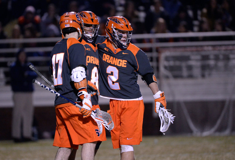 Kevin Rice (right) huddles with Lecky (middle) and Dylan Donahue. 
