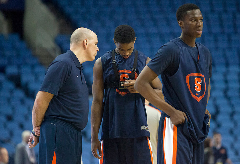Fair talks with trainer Brad Pike at Syracuse's practice in First Niagara Center on Wednesday.