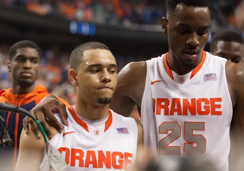 Rakeem Christmas (right) consoles Tyler Ennis (left) after Syracuse's loss. 