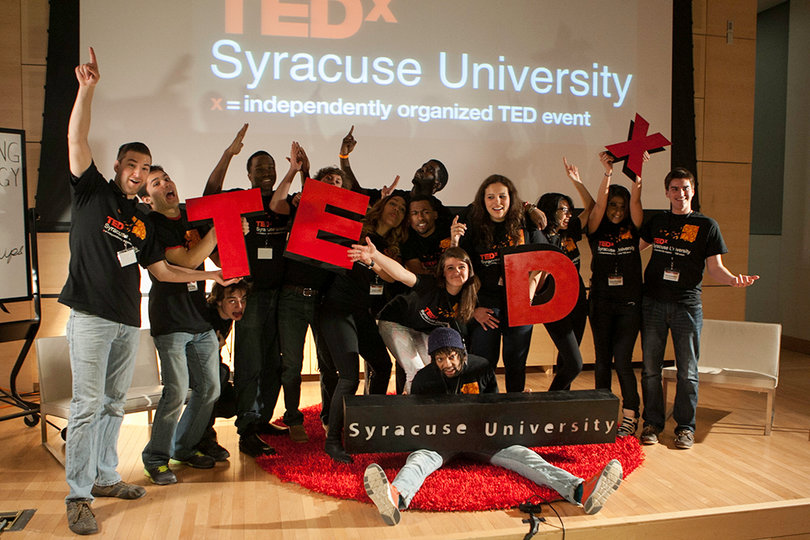 The TEDxSyracuseUniversity team of organizers poses onstage after the event. 