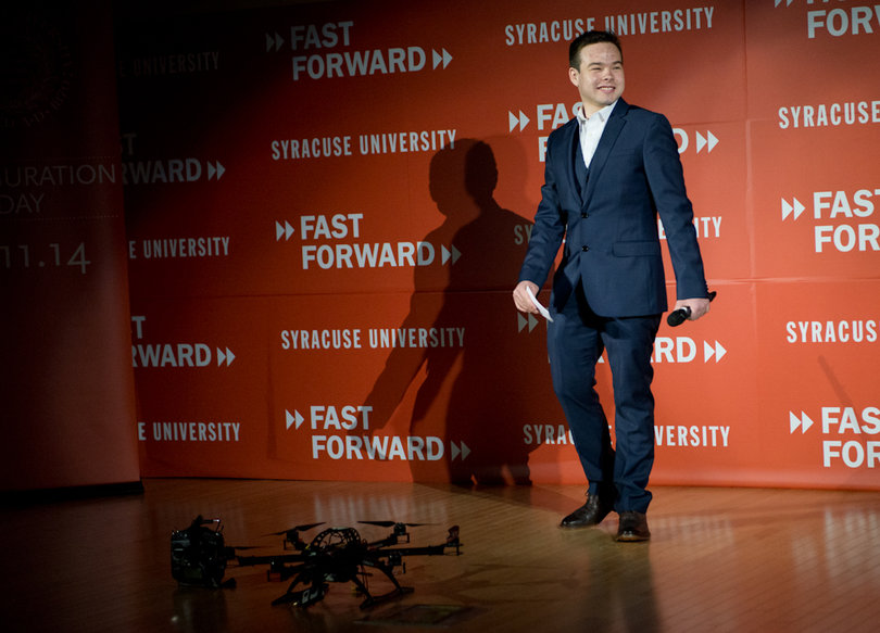 Arland Whitfield uses a drone as a prop for his presentation of his project, the Skyworks Initiative.