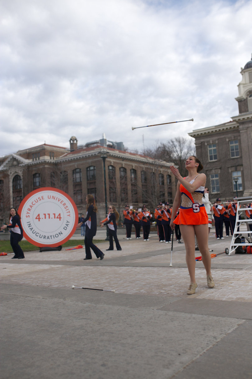 Baton twirler, Meghan Sinisi, performs during the inauguration ceremony in the quad on April 11, 2014.