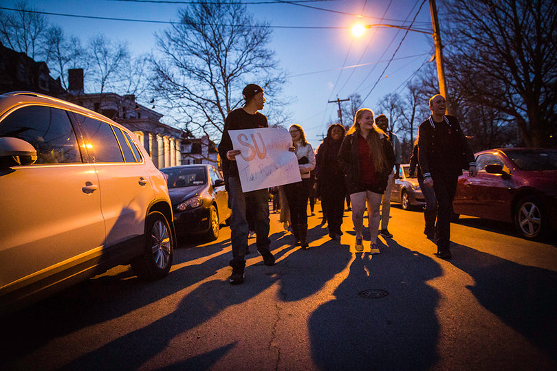 Students, faculty and community members march as part of Take Back the Night, collaborating to shed light on issues of sexual violence.