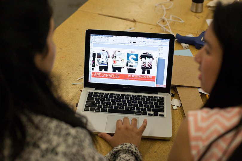 (From left) Karina Campos and Tiffany Soohoo won a competition to design the Connective Corridor billboard. The duo will feature Syracuse community members as a key part of their theme, which is “We Are Syracuse.”                 
