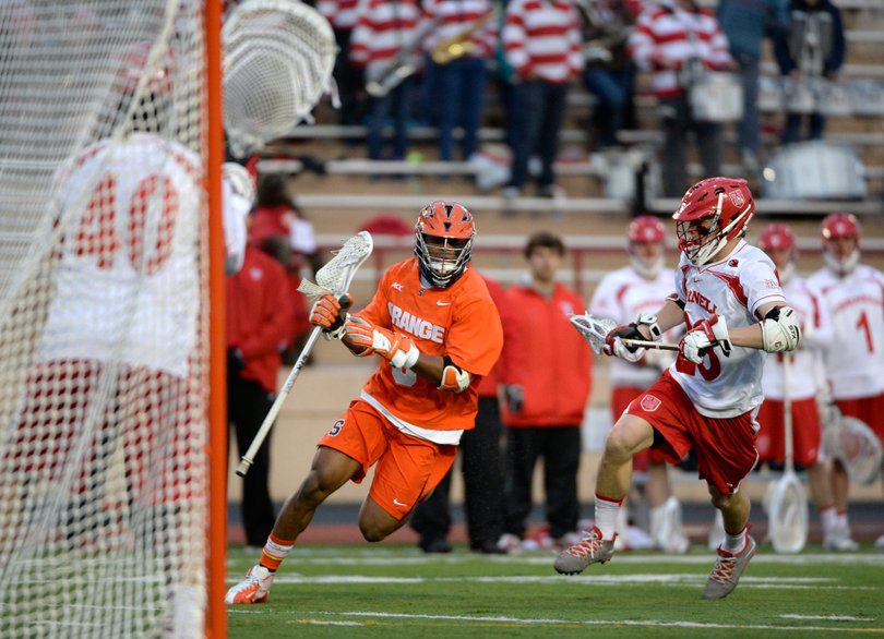 Midfielder Hakeem Lecky dodges past a Cornell defender with his eyes on the goal. 