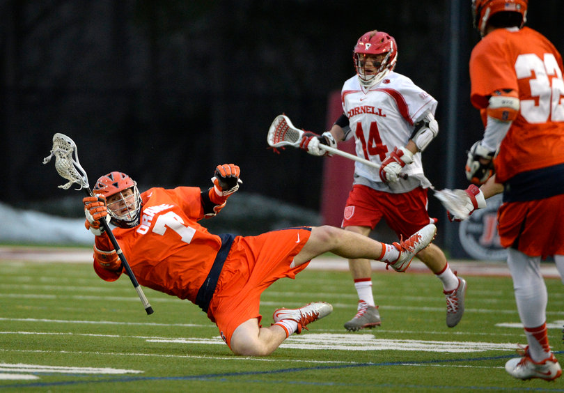 Midfielder Henry Schoonmaker slips while keeping possession of the ball.