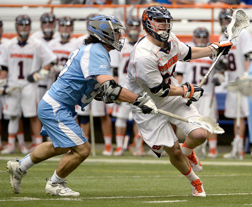 A Syracuse player looks to create space on offense. 