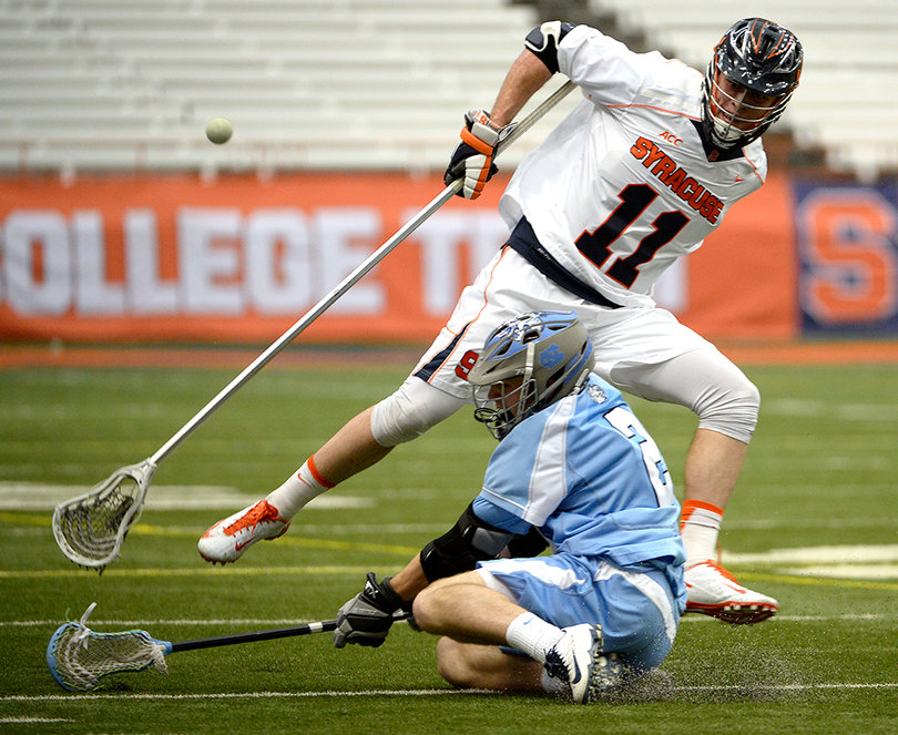 Brandon Mullins goes for a ground ball as a UNC player falls on the turf. 