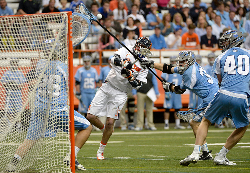 NorthCarolina goalieKieran Burkelooks to stop a Syracuse shot. 