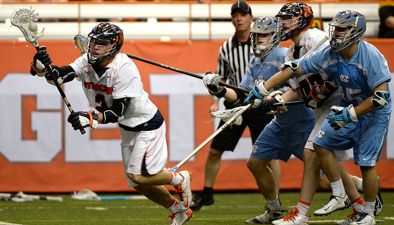 Kevin Rice takes a pass as NorthCarolina players converge on him. 