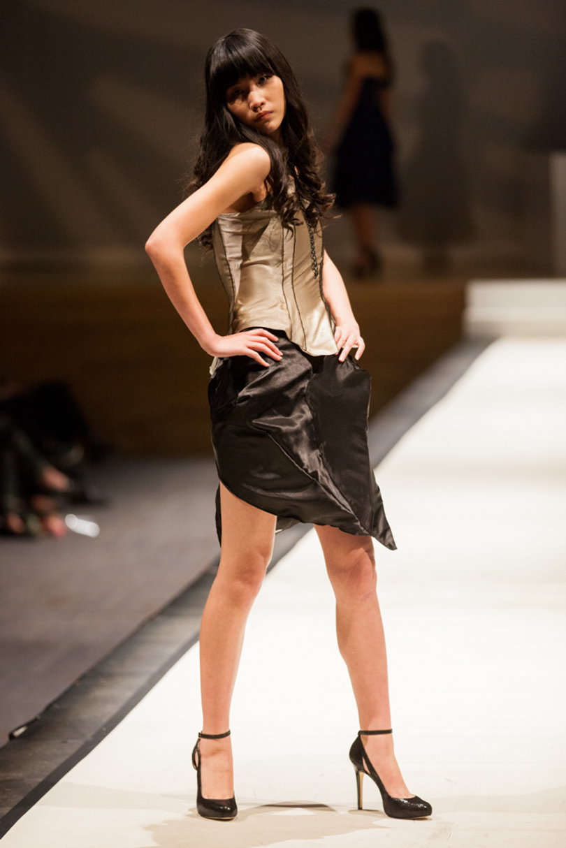 Amy Wang strikes a pose in Goldstein Auditorium, modeling an outfit designed by Hayley Neremberg. 