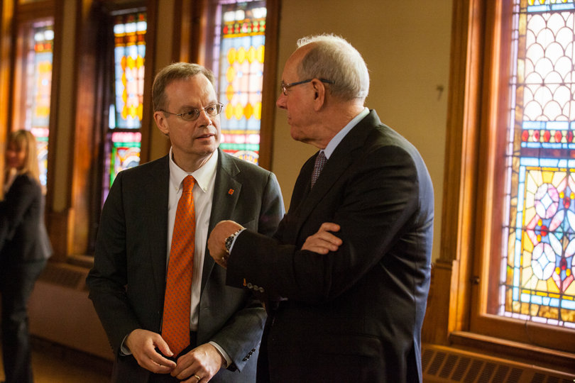 Chancellor Kent Syverud speaks with Jim Boeheim, SU head men’s basketball coach, following the symposium. Boeheim commented on the interplay between academics and athletics in the future, joking that he thought he was the "least academically-qualified" of the panelists.