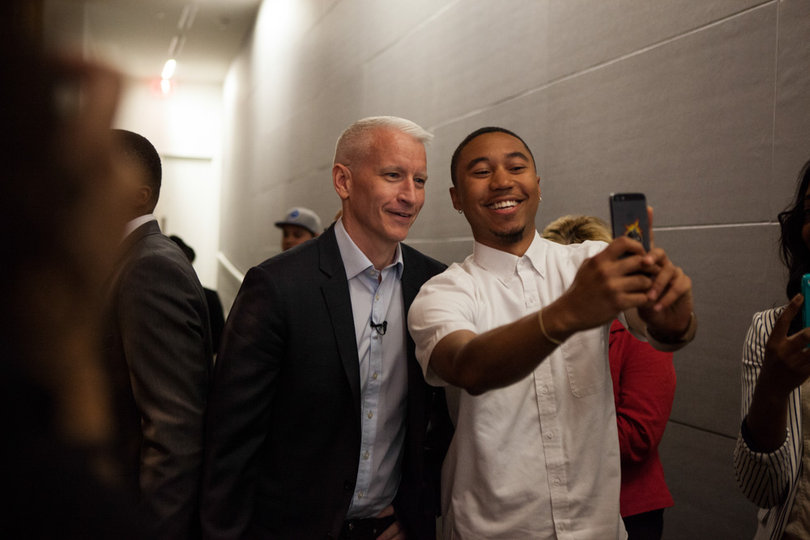 Troy James, a senior advertising major, takes a "selfie" with Cooper. 