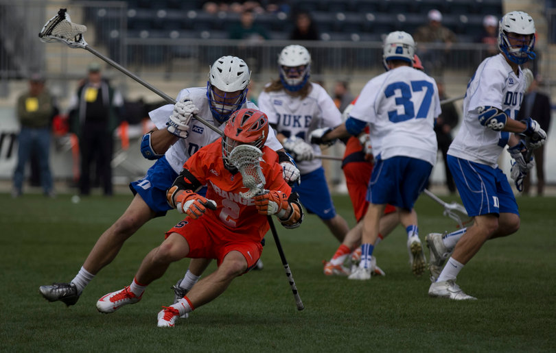 Kevin Rice is defended by Chris Hipps of Duke. Rice finished the game with 5 assist.