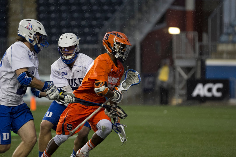 Drew Jenkins splits a Duke double team as he sprints upfield.