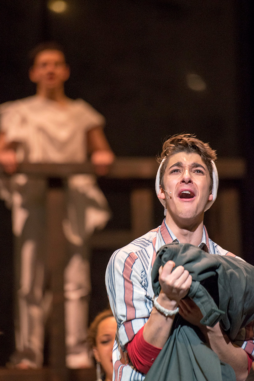 Chris Pino, playing Tom Collins, sings the reprise of “I’ll Cover You.” “Rent,” written by playwright and composer Jonathon Larson, recounts the story of young artists struggling to make ends meet in New York’s Lower East Side in the 1990s. 