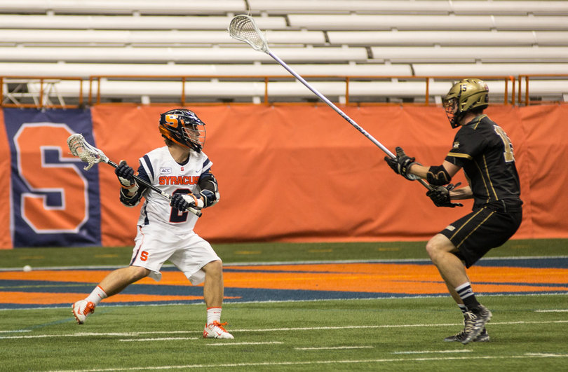 Kevin Rice surveys his options under defensive pressure. Rice scored three goals from 12 shots and had one assist Sunday night.